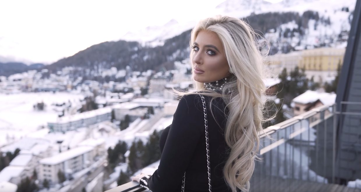 Blonde model posing in the snow